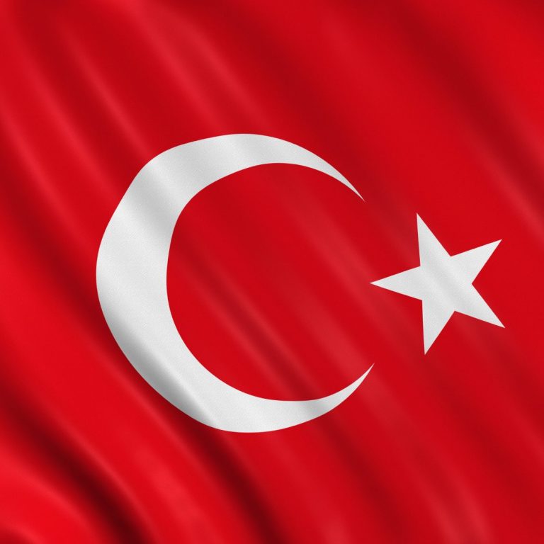 Rot-weiße Flagge mit einem Halbmond und einem Stern.